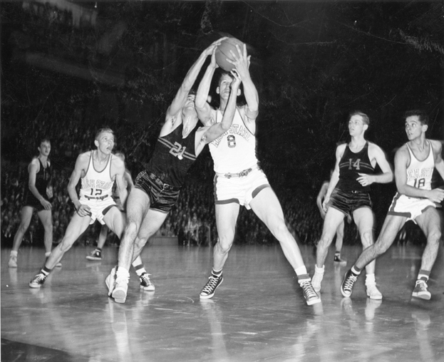 Basketball players fight for the ball, ca. 1950-1951 Basketball players fight for the ball, ca. 1950-1951